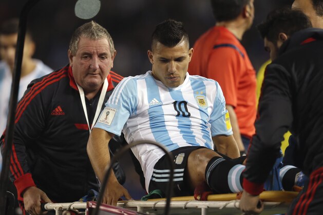 Argentina's Sergio Aguero is carried off the filed after an injury during a 2018 Russia World Cup qualifying soccer match against Ecuador in Buenos Aires, Argentina, Thursday, Oct. 8, 2015. (AP Photo/Natacha Pisarenko)