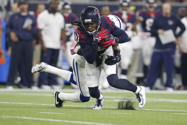 Oct 8, 2015; Houston, TX, USA; Houston Texans receiver DeAndre Hopkins (10) makes a catch in the first quarter against Indianapolis Colts  cornerback Greg Toler (28) at NRG Stadium. Mandatory Credit: Matthew Emmons-USA TODAY Sports