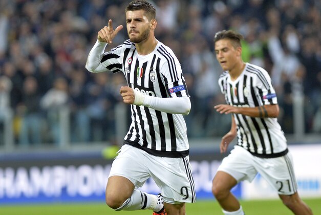 Juventus Alvaro Morata celebrates after he scored during the Champions League group D soccer match between Juventus and FC Sevilla, at the Juventus Stadium in Turin, Italy, Wednesday, Sept. 30, 2015. (AP Photo/Massimo Pinca)