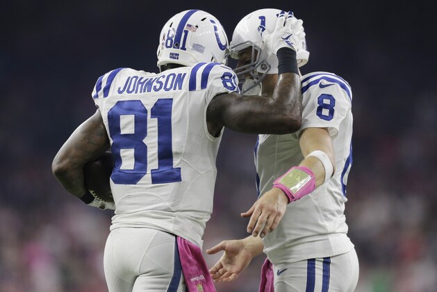 Indianapolis Colts' Andre Johnson (81) celebrates with teammate Matt Hasselbeck (8) after they connected for on a touchdown pass during the second half of an NFL football game against the Houston Texans, Thursday, Oct. 8, 2015, in Houston. (AP Photo/Patric Schneider)