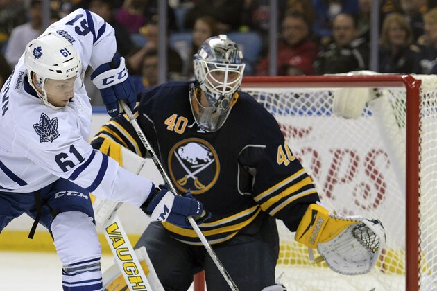 FILE - In this Sept. 29, 2015, file photo, Toronto Maple Leafs forward Connor Brown (61) deflects the puck at Buffalo Sabres goaltender Robin Lehner (40), of Sweden, during the second period of a preseason NHL hockey game in Buffalo, N.Y. Buffalo Sabres general manager Tim Murray solidified Lehner from Ottawa, contributing to one of NHL's most radically changed lineups entering this season. (AP Photo/Gary Wiepert, File)
