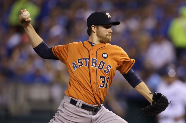Houston Astros starting pitcher Collin McHugh throws during the first inning in Game 1 of baseball's American League Division Series against the Kansas City Royals, Thursday, Oct. 8, 2015, in Kansas City. (AP Photo/Orlin Wagner)
