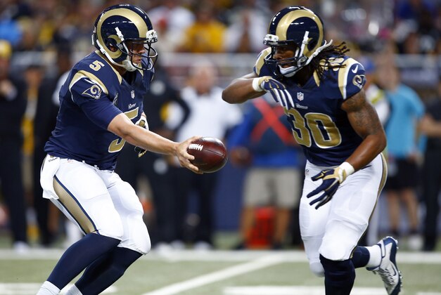 St. Louis Rams quarterback Nick Foles, left, hands off to running back Todd Gurley during the second quarter of an NFL football game against the Pittsburgh Steelers Sunday, Sept. 27, 2015, in St. Louis. (AP Photo/Billy Hurst)