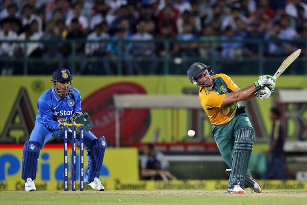 South Africa's AB de Villiers misses the ball to be clean bowled by India's Ravichandran Ashwin during their first Twenty20 cricket match in Dharmsala, India, Friday, Oct. 2, 2015. (AP Photo /Tsering Topgyal)