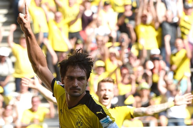Dortmund's defender Mats Hummels celebrates during the German first division Bundesliga football match Borussia Dortmund vs Hertha BSC in Dortmund, Germany, on August 30, 2015.  AFP PHOTO / PATRIK STOLLARZ
RESTRICTIONS: DURING MATCH TIME: DFL RULES TO LIMIT THE ONLINE USAGE TO 15 PICTURES PER MATCH AND FORBID IMAGE SEQUENCES TO SIMULATE VIDEO. 
== RESTRICTED TO EDITORIAL USE ==
FOR FURTHER QUERIES PLEASE CONTACT DFL DIRECTLY AT + 49 69 650050.        (Photo credit should read PATRIK STOLLARZ/AFP/Getty Images)