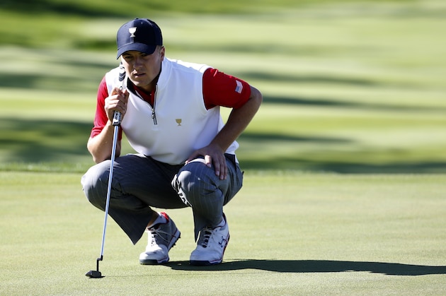 United States' Jordan Spieth lines up his putt on the third hole during his four ball match at the Presidents Cup golf tournament at the Jack Nicklaus Golf Club Korea, in Incheon, South Korea, Friday, Oct. 9, 2015.(AP Photo/Lee Jin-man)