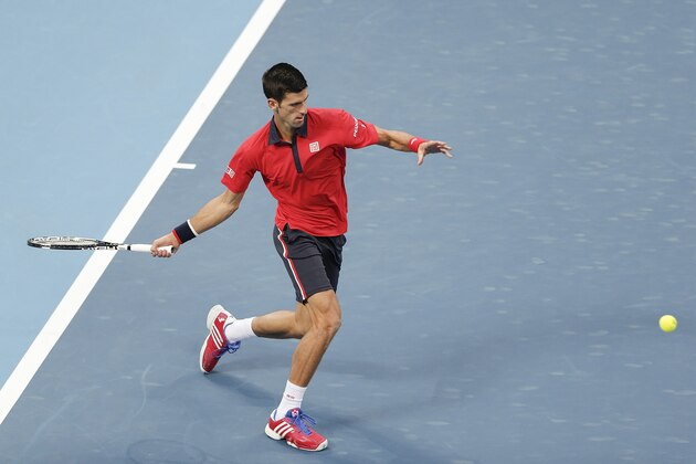 BEIJING, CHINA - OCTOBER 08:  Novak Djokovic of Serbia returns a shot against Zhang Ze of China  during the Men's singles second round match on day six of the 2015 China Open at the China National Tennis Centre on October 8, 2015 in Beijing, China.  (Photo by Lintao Zhang/Getty Images)