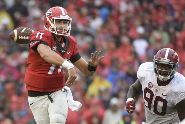 Oct 3, 2015; Athens, GA, USA; Georgia Bulldogs quarterback Greyson Lambert (11) loses control of a pass during the second quarter against the Alabama Crimson Tide at Sanford Stadium. Mandatory Credit: John David Mercer-USA TODAY Sports