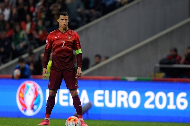 Portugal’s Cristiano Ronaldo gets ready to shoot a free kick during the Euro 2016 qualifying group I soccer match between Portugal and Denmark at the Municipal Stadium in Braga, Portugal, Thursday, Oct. 8 2015. Portugal defeated Denmark 1-0. (AP Photo/Paulo Duarte)