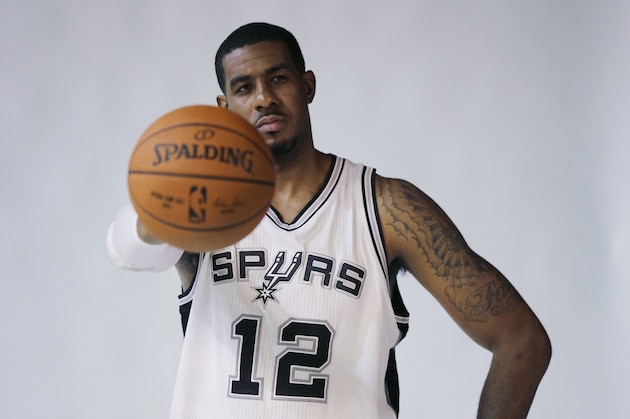 San Antonio Spurs' LaMarcus Aldridge (12) poses for photos during media day at the team's practice facility, Monday, Sept. 28, 2015, in San Antonio. (AP Photo/Eric Gay)