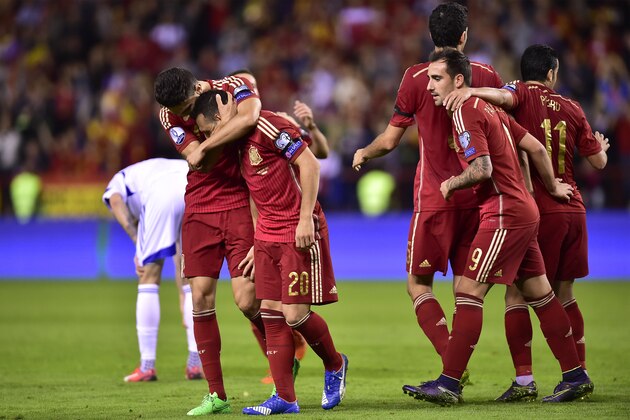 Spain's Santi Cazorla, second left, celebrates with teammates after scoring during their Euro 2016 qualifying soccer match, Group C, between Spain and Luxembourg, at Las Gaunas stadium in Logrono, northern Spain, Friday, Oct. 9, 2015. (AP Photo/Alvaro Barrientos)