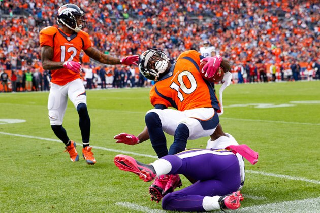 DENVER, CO - OCTOBER 4:  Wide receiver Emmanuel Sanders #10 of the Denver Broncos is tackled by cornerback Xavier Rhodes #29 of the Minnesota Vikings at the end of a 43 yard reception in the third quarter of a game at Sports Authority Field at Mile High on October 4, 2015 in Denver, Colorado.  (Photo by Doug Pensinger/Getty Images)