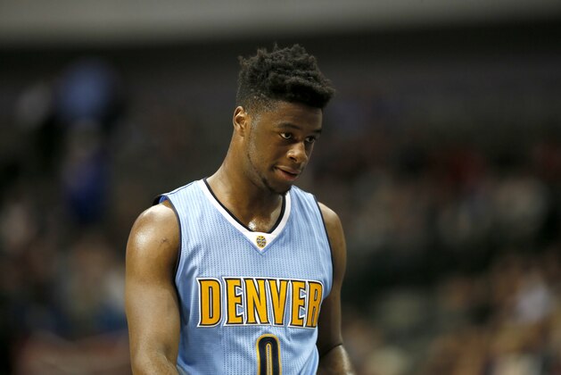 Denver Nuggets guard Emmanuel Mudiay (0) of Congo walks to the bench in an NBA preseason basketball game against the Dallas Mavericks on Tuesday, Oct. 6, 2015, in Dallas. (AP Photo/Tony Gutierrez)