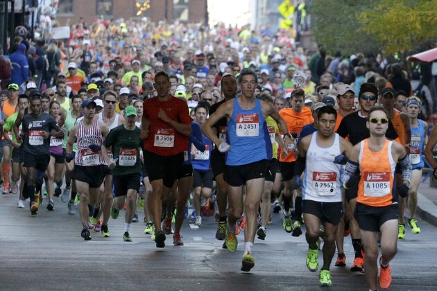 Runners participate in the Chicago Marathon in Chicago on Sunday, Oct. 12, 2014. (AP Photo/Nam Y. Huh)