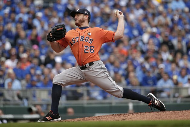 Houston Astros starting pitcher Scott Kazmir throws during the first inning of Game 2 in baseball's American League Division Series against the Kansas City Royals, Friday, Oct. 9, 2015, in Kansas City, Mo. (AP Photo/Charlie Riedel)