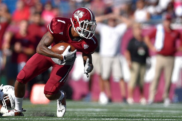 Massachusetts wide receiver Tajae Sharpe (1) runs with the ball in the first half of an NCAA college football game at Gillette Stadium in Foxborough, Mass., Saturday, Sept. 19, 2015. (AP Photo/Gretchen Ertl)
