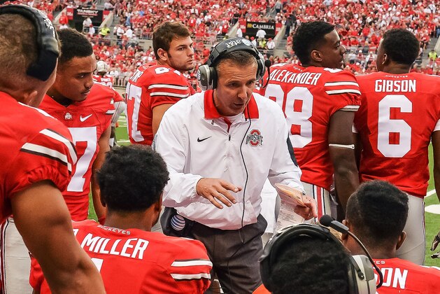 COLUMBUS, OH - SEPTEMBER 26:  Head Coach Urban Meyer of the Ohio State Buckeyes instructs his team on the bench during a game against the Western Michigan Broncos at Ohio Stadium on September 26, 2015 in Columbus, Ohio.   (Photo by Jamie Sabau/Getty Images)