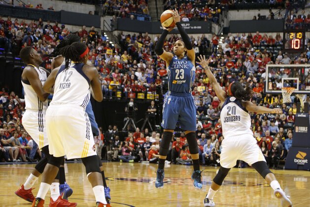Oct 9, 2015; Indianapolis, IN, USA; Minnesota Lynx forward Maya Moore (23) takes a shot against Indiana Fever guard Briann January (20) during game three of the WNBA Finals at Bankers Life Fieldhouse. Mandatory Credit: Brian Spurlock-USA TODAY Sports