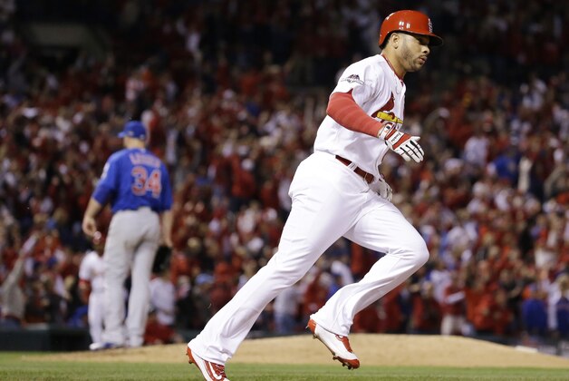 St. Louis Cardinals' Tommy Pham runs after hitting a solo home run off Chicago Cubs starting pitcher Jon Lester (34) during the eighth inning of Game 1 in baseball's National League Division Series Friday, Oct. 9, 2015, in St. Louis. (AP Photo/Jeff Roberson)