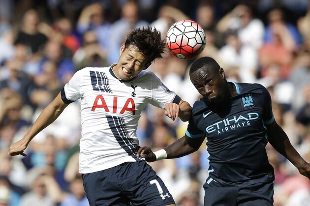 Tottenham Hotspur's Son Heung-min competes for the ball with Manchester City's Bacary Sagna during the English Premier League soccer match between Tottenham Hotspur and Manchester City at White Hart Lane stadium in London, Saturday, Sept. 26, 2015.  (AP Photo/Matt Dunham)