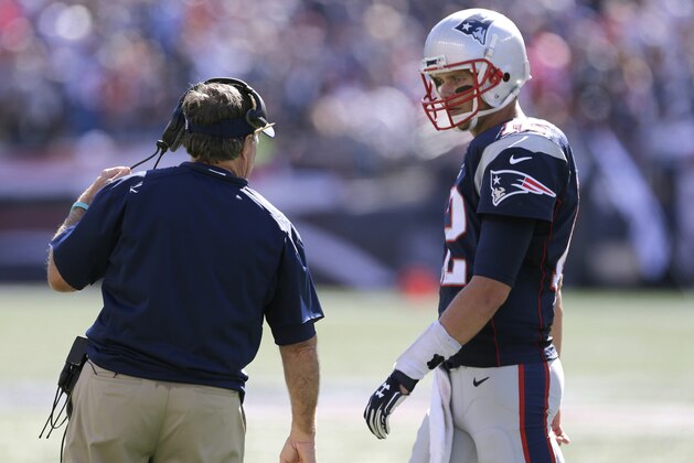 New England Patriots quarterback Tom Brady , right, talk with head coach Bill Belichick in the first half of an NFL football game, Sunday, Sept. 27, 2015, in Foxborough, Mass. (AP Photo/Charles Krupa)