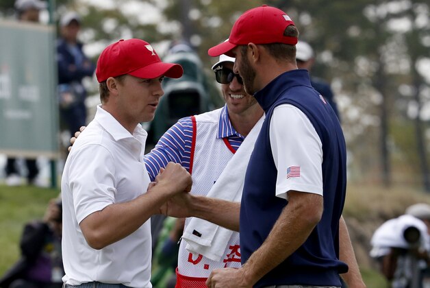 United States' Dustin Johnson right, and teammate Jordan Spieth celebrate after winning their foursome match at the Presidents Cup golf tournament at the Jack Nicklaus Golf Club Korea, in Incheon, South Korea, Saturday, Oct. 10, 2015.(AP Photo/Lee Jin-man)