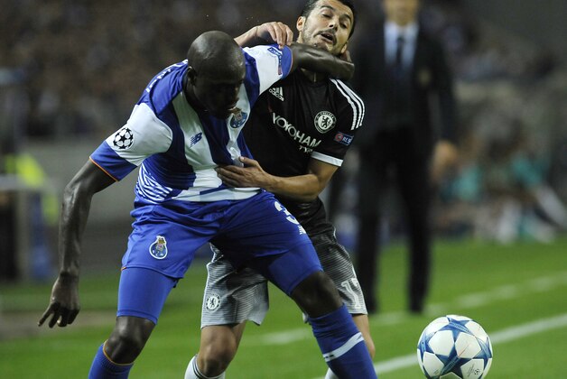 Chelsea's Pedro Rodriguez, right, is stopped by Porto’s Bruno Martins Indi  during the Champions League group G soccer match between FC Porto and Chelsea FC at the Dragao stadium in Porto, Portugal, Tuesday, Sept. 29, 2015. (AP Photo/Paulo Duarte)