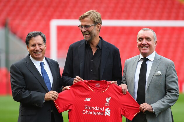 LIVERPOOL, ENGLAND - OCTOBER 09:  Jurgen Klopp is unveiled as the new manager of Liverpool FC as he stands alongside Tom Werner (l) the chairman and Ian Ayre (r) the chief executive during a photocall at Anfield on October 9, 2015 in Liverpool, England.  (Photo by Alex Livesey/Getty Images)
