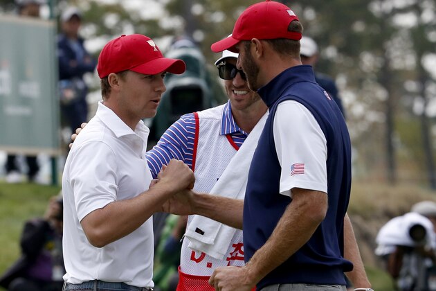United States' Dustin Johnson right, and teammate Jordan Spieth celebrate after winning their foursome match at the Presidents Cup golf tournament at the Jack Nicklaus Golf Club Korea, in Incheon, South Korea, Saturday, Oct. 10, 2015.(AP Photo/Lee Jin-man)