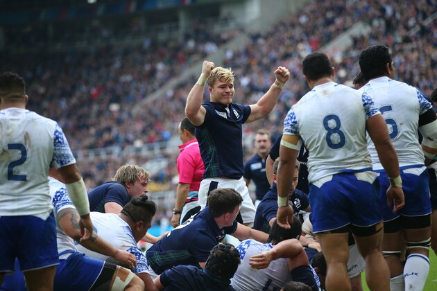 NEWCASTLE, ENGLAND - OCTOBER  10:  David Denton of Scotland raises his arms as John Hardie of Scotland scores a try during the 2015 Rugby World Cup Pool B match between Samoa and Scotland at St James Park on October 10, 2015 in Newcastle, England. (Photo by Ian MacNicol/Getty Images)