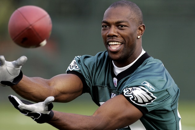 Philadelphia Eagles receiver Terrell Owens plays catch before practice at the team's training camp in Bethlehem, Pa., Tuesday, Aug. 2, 2005. (AP Photo/Coke Whitworth)