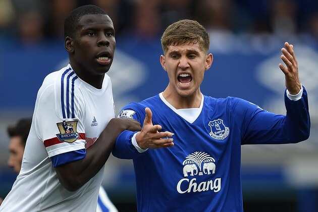 Everton's English defender John Stones (R) reacts as he vies against Chelsea's French defender Kurt Zouma during the English Premier League football match between Everton and Chelsea at Goodison Park in Liverpool on September 12, 2015. AFP PHOTO / PAUL ELLIS

RESTRICTED TO EDITORIAL USE. No use with unauthorized audio, video, data, fixture lists, club/league logos or 'live' services. Online in-match use limited to 75 images, no video emulation. No use in betting, games or single club/league/player publications.        (Photo credit should read PAUL ELLIS/AFP/Getty Images)