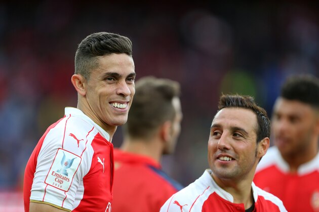 LONDON, ENGLAND - JULY 26: Gabriel Paulista of Arsenal and Santi Cazorla of Arsenal after the Emirates Cup match between Arsenal and VfL Wolfsburg at Emirates Stadium on July 26, 2015 in London, England.  (Photo by Catherine Ivill - AMA/Getty Images).