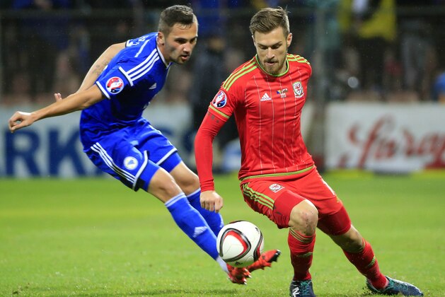 ZENICA, BOSNIA AND HERZEGOVINA - OCTOBER 10: Aaron Ramsey (R) of Wales in action against Anel Hadzic (L) of Bosnia during  the Euro 2016 qualifying football match between Bosnia and Herzegovina and Wales at the Stadium Bilino Polje in Elbasan on October 10, 2015.  (Photo by Srdjan Stevanovic/Getty Images)
