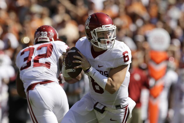 Oklahoma quarterback Baker Mayfield (6) rolls out of the pocket in the first half of an NCAA college football game against Texas Saturday, Oct. 10, 2015, in Dallas. (AP Photo/LM Otero)