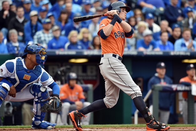 Oct 9, 2015; Kansas City, MO, USA; Houston Astros left fielder Colby Rasmus hits a RBI double against the Kansas City Royals in the first inning in game two of the ALDS at Kauffman Stadium. Mandatory Credit: Peter G. Aiken-USA TODAY Sports