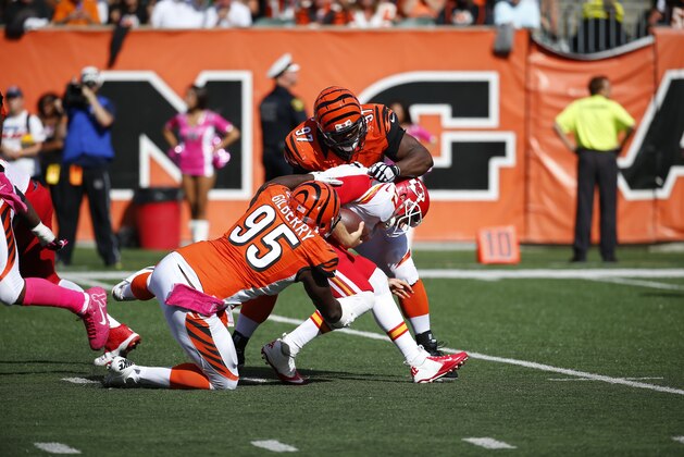 Kansas City Chiefs quarterback Alex Smith (11) is sacked by Cincinnati Bengals defensive tackle Geno Atkins (97) in the second half of an NFL football game, Sunday, Oct. 4, 2015, in Cincinnati. (AP Photo/Paul Sancya)