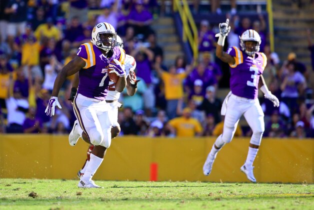 Oct 10, 2015; Baton Rouge, LA, USA; LSU Tigers running back Leonard Fournette (7) runs for an 87-yard touchdown during the third quarter of a game against the South Carolina Gamecocks at Tiger Stadium.  Mandatory Credit: Derick E. Hingle-USA TODAY Sports
