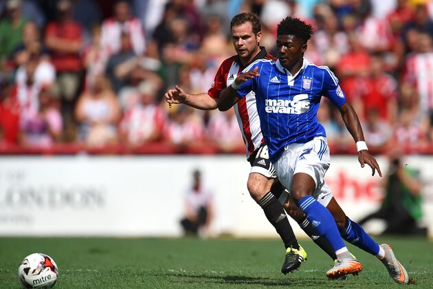 BRENTFORD, ENGLAND - AUGUST 08: Alan Judge of Brentford and Ainsley Maitland-Niles of Ipswich Town in action during the Sky Bet Championship match between Brentford and Ipswich Town at Griffin Park on August 8, 2015 in Brentford, England. (Photo by Tom Dulat/Getty Images)