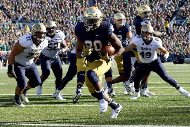 Notre Dame running back C.J. Prosise (20) runs in for a touchdown against Navy during the first half of an NCAA college football game, Saturday, Oct. 10, 2015, in South Bend, Ind. (AP Photo/Jeff Haynes)
