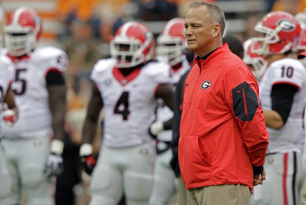 Georgia head coach Mark Richt watches as his team warms up before the start of an NCAA college football game against Tennessee Saturday, Oct. 10, 2015 in Knoxville, Tenn. (AP Photo/Wade Payne)