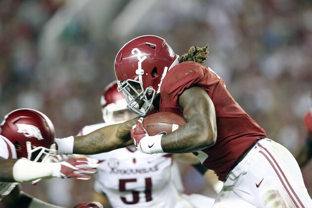 Alabama running back Derrick Henry (2) runs the ball against Arkansas in the first half of an NCAA college football game, Saturday, Oct. 10, 2015, in Tuscaloosa, Ala. (AP Photo/Brynn Anderson)