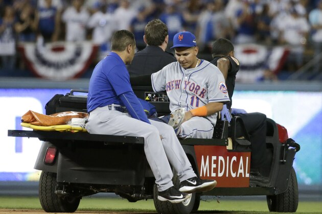 New York Mets shortstop Ruben Tejada is taken off the field after being hurt in a double play against the Los Angeles Dodgers during the seventh inning in Game 2 of baseball's National League Division Series, Saturday, Oct. 10, 2015 in Los Angeles. (AP Photo/Gregory Bull)
