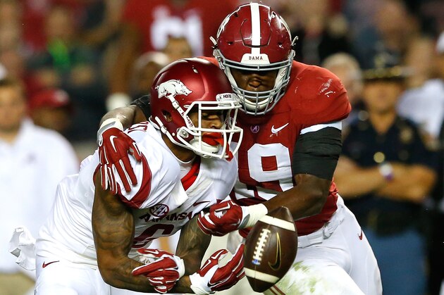 TUSCALOOSA, AL - OCTOBER 10:  Reggie Ragland #19 of the Alabama Crimson Tide breaks up this reception intended for Kendrick Edwards #6 of the Arkansas Razorbacks at Bryant-Denny Stadium on October 10, 2015 in Tuscaloosa, Alabama.  (Photo by Kevin C. Cox/Getty Images)