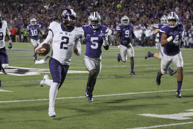 Oct 10, 2015; Manhattan, KS, USA; TCU Horned Frogs quarterback Trevone Boykin (2) runs away from Kansas State Wildcats defensive backs Jesse Mack (5) and Kaleb Prewett (4) for a touchdown during the Horned Frogs' 53-45 win at Bill Snyder Family Football Stadium. Mandatory Credit: Scott Sewell-USA TODAY Sports