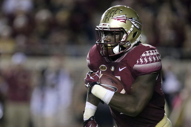 Florida State's Dalvin Cook picks up yardage against Miami in the second quarter of an NCAA college football game Saturday, Oct. 10, 2015 in Tallahassee, Fla. Florida State won the game 29-24. (AP Photo/Steve Cannon)