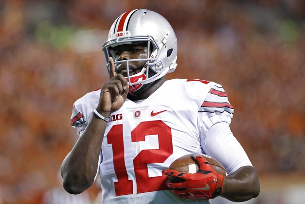 Sep 7, 2015; Blacksburg, VA, USA; Ohio State Buckeyes quarterback Cardale Jones (12) gestures while running with the ball against the Virginia Tech Hokies at Lane Stadium. Mandatory Credit: Geoff Burke-USA TODAY Sports
