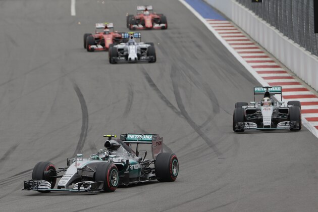 Mercedes driver Nico Rosberg of Germany leads his teammate Mercedes driver Lewis Hamilton of Britain during the Formula One Russian Grand Prix at the Sochi Autodrom, in Sochi, Russia, Sunday, Oct. 11, 2015. (AP Photo/Luca Bruno)