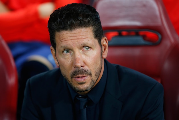 Atletico's coach Diego Simeone waits for the start of the Champions League group C soccer match between Atletico de Madrid and Benfica at the Vicente Calderon stadium in Madrid, Wednesday, Sept. 30, 2015.  (AP Photo/Francisco Seco)