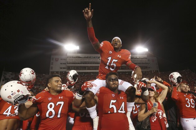 Utah defensive back Dominique Hatfield sits on the shoulders of offensive lineman Isaac Asiata (54) while celebrating with the team after Utah defeated California 30-24 during an NCAA college football game Saturday, Oct. 10, 2015, in Salt Lake City. (AP Photo/Kim Raff)
